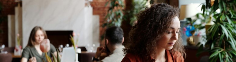 An interiorscape professional preparing client meeting notes for interiorscape services